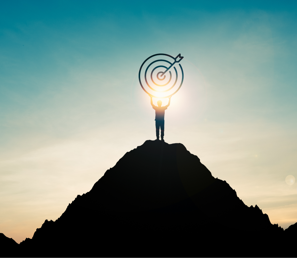 Person holding target symbol on mountain peak
